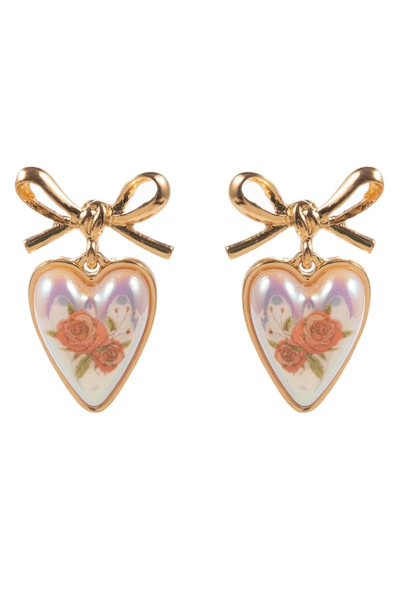 Heart-shaped earrings with floral design and gold bows on a white background