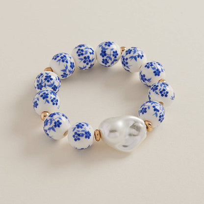 Ceramic beads with organic-shaped pearl charm bracelet by Designature New York, featuring a delicate charm and elegant design.