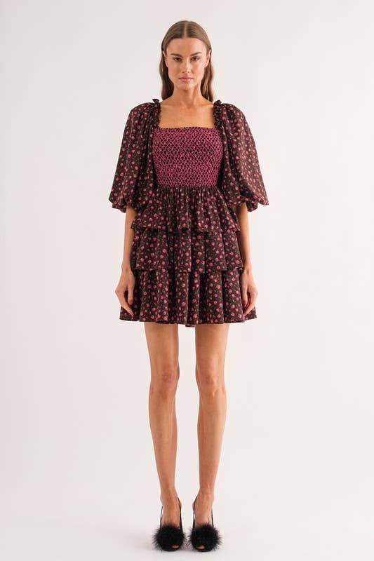 Sofie the Label Bri mini dress displayed on a mannequin, featuring a stylish, fitted design with a sleeveless cut and floral pattern.