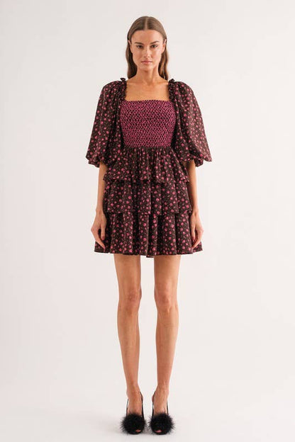 Sofie the Label Bri mini dress displayed on a mannequin, featuring a stylish, fitted design with a sleeveless cut and floral pattern.