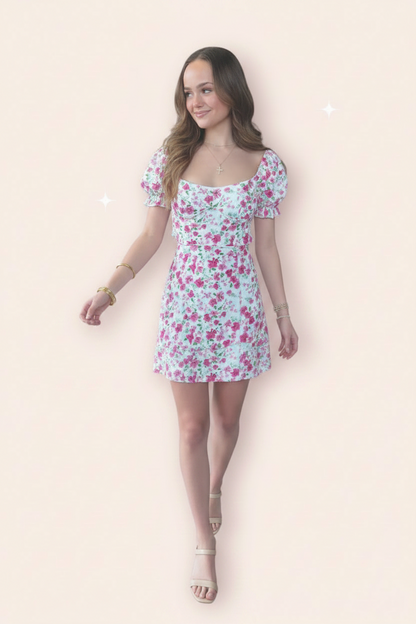 esscoco Adeline floral halter dress featuring a vibrant floral pattern and flowing fabric, shown on a model.