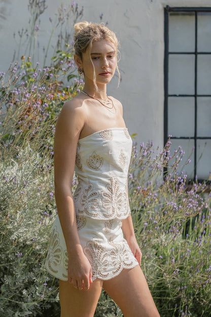 ILLΑ ILLA Calla embroidered strapless mini dress with intricate embroidery and a fitted silhouette, perfect for stylish occasions.