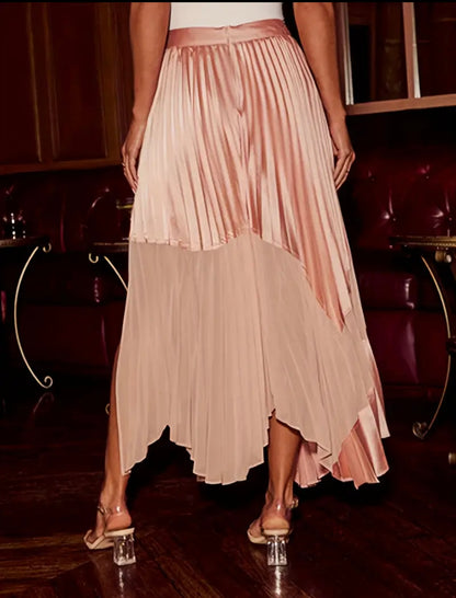 Essecoco pink asymmetrical pleated skirt with irregular layered design, full view showing flowing fabric and stylish silhouette.