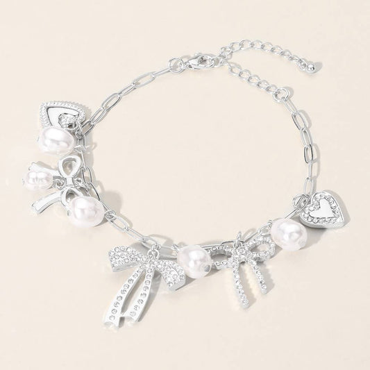 Stone Paved Silver Bow Heart Pearl Charm Station Chain Bracelet