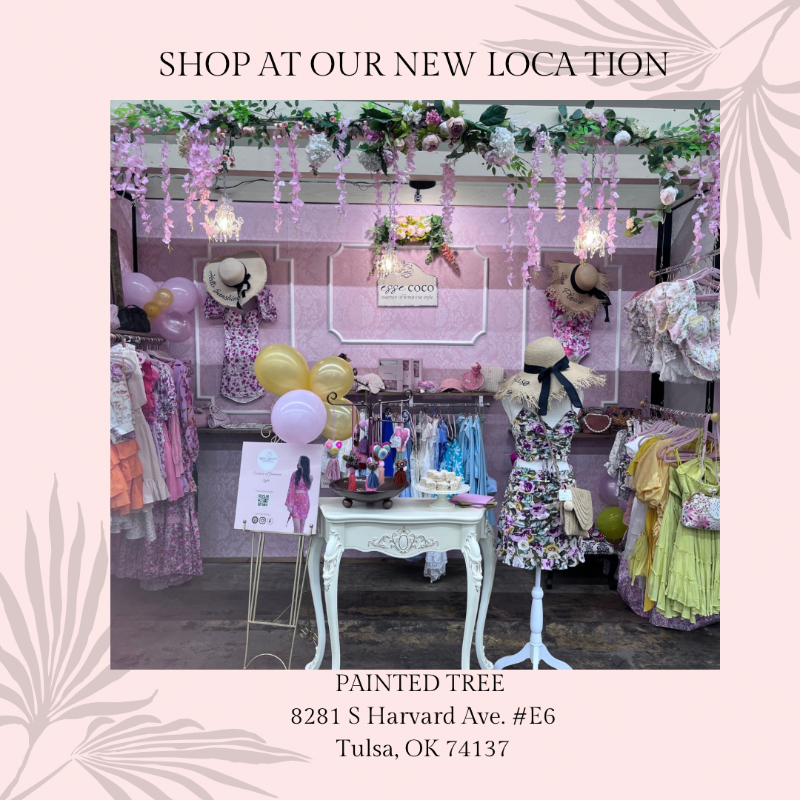 Promotional image for a new location with mannequins, clothing, and balloons in a store setting.