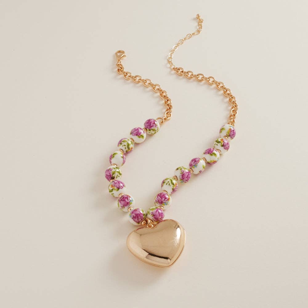 Designature New York puffy heart necklace with ceramic bead, featuring a short chain and delicate jewelry design.