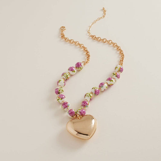 Designature New York puffy heart necklace with ceramic bead, featuring a short chain and delicate jewelry design.